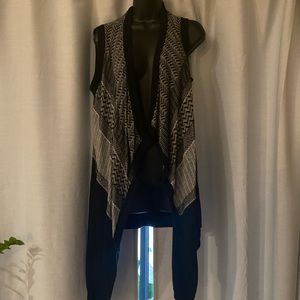 White, black and gray cardigan
